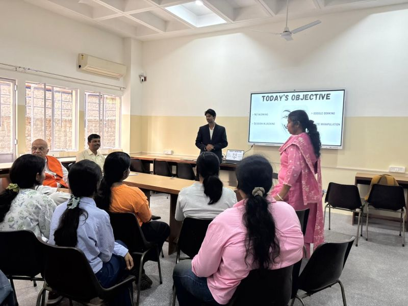 Kartik Bhattacharya conducting a cybersecurity training session for students with Today's Objective slide covering networking, Google dorking and session hijacking